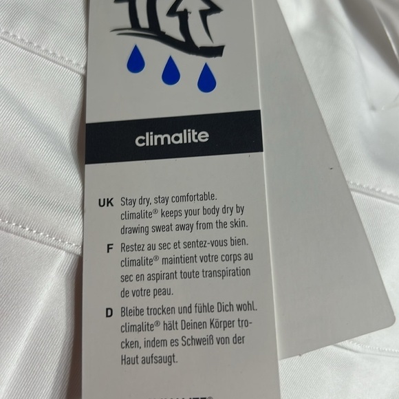 ADIDAS white skort with pleats on the bottom  half . Then two horizontal bands. - Picture 8 of 11